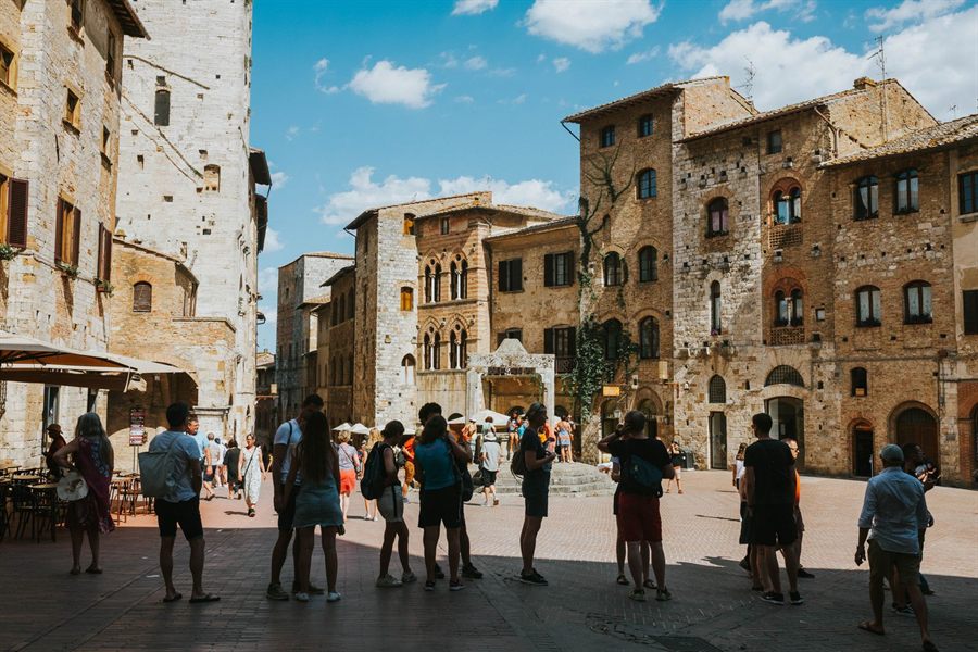 Visitors in a medieval Italian square